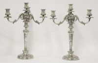 Lot 122 - A pair of George III silver four-light candelabra