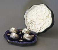 Lot 175 - A cased set of four silver salts and spoons