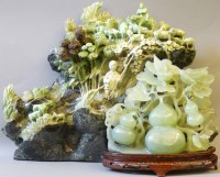 Lot 346 - A large and ornate modern soapstone carving