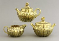 Lot 140 - A George IV/Victorian silver gilt three-piece tea set