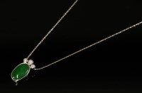 Lot 458 - An 18ct white gold jade and diamond pendant