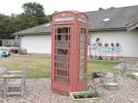 Lot 551 - A Giles Gilbert Scott designed red London telephone box
