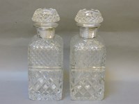 Lot 178 - A pair of silver mounted cut glass whisky decanters