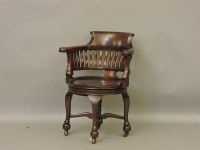 Lot 399 - A 19th century mahogany revolving desk chair