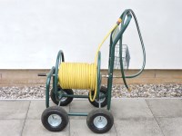 Lot 518 - A four wheel hose pipe trolley