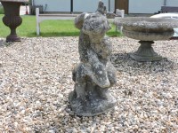 Lot 593 - A composite stone garden ornament