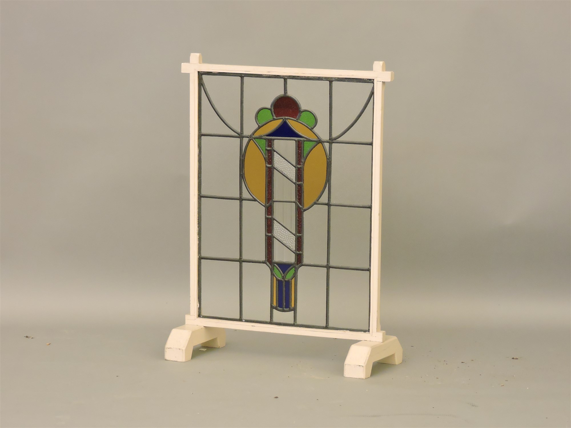Lot 437 An Art Deco stained glass fire screen