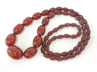 Lot 1 - A single row of graduating olive shaped bakelite beads