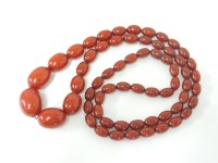 Lot 2 - A single row of graduating olive shaped bakelite beads