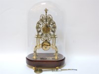 Lot 304 - A brass skeleton clock