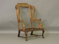 Lot 389 - A William and Mary walnut wing back armchair frame