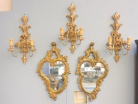 Lot 133 - A pair of modern cartouche shaped wall mirrors