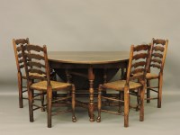 Lot 386 - A reproduction George III style oak gateleg table
