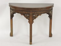 Lot 519 - A 19th/20th century French Gothic Revival oak fold over demi lune card table