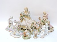 Lot 199 - A Capodimonte porcelain figurine of a girl holding a basket of flowers