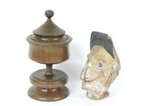 Lot 84 - A carved and painted wooden puppet head