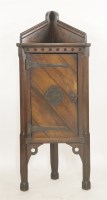 Lot 480 - A 'Gothic' oak corner cupboard