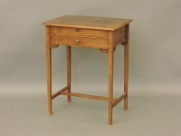 Lot 483 - An oak sewing table