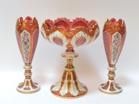 Lot 218 - A Victorian cranberry glass and white enamel bowl