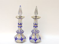 Lot 316 - A pair of Victorian flash cut glass bottles and stoppers