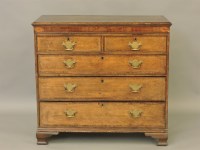 Lot 418 - A George III oak chest of drawers