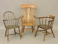 Lot 451 - Three wooden elbow chairs