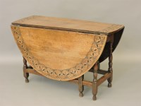 Lot 408 - An oak drop leaf table