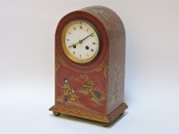 Lot 242 - A red lacquered mantel clock