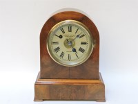 Lot 228 - A Victorian walnut clock