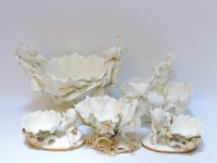 Lot 219 - Five white pottery cherub centrepieces