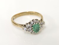 Lot 46 - A 9ct gold emerald and diamond lozenge shaped cluster ring