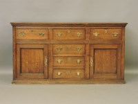 Lot 481 - A George III oak sideboard