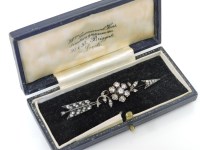 Lot 49 - A Victorian diamond floral cluster and arrow brooch