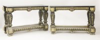 Lot 443 - A pair of Italian carved ebonised and giltwood console tables