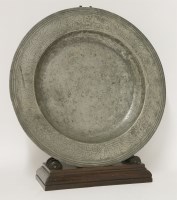 Lot 64 - A pewter broad rim charger
17th century