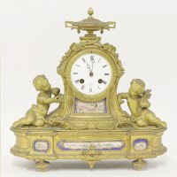 Lot 336 - A French gilt bronze and porcelain-mounted mantel clock