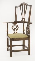 Lot 375 - A George III elm corner armchair