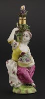 Lot 23 - A 'Girl in a Swing' type gold-mounted porcelain scent bottle
modelled as a lady seated by a vine