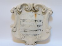 Lot 217 - A carved marble shield shaped escutcheon