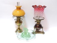 Lot 326 - Two brass oil lamps