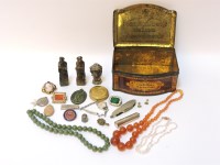 Lot 67 - An old tin of jewellery and collector's items