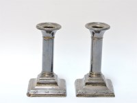 Lot 118 - A pair of dwarf silver candlesticks