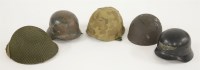 Lot 160 - Two German and three other military helmets