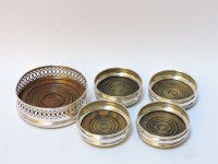 Lot 115 - A set of four silver bottle coasters