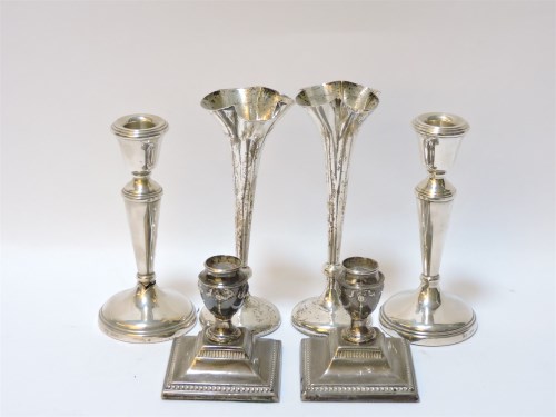 Lot 133 - Two pairs of squat filled silver candlesticks