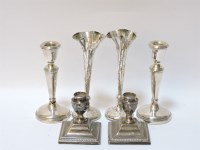 Lot 133 - Two pairs of squat filled silver candlesticks