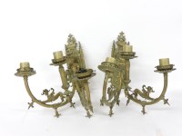 Lot 203 - A pair of Victorian Gothic Revival twin branch three light brass wall lights