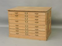 Lot 473 - A 20th century panelled pine plan chest of eight drawers