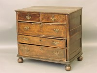 Lot 475 - An 18th century walnut chest of two short and three long drawers