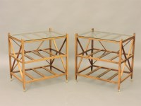 Lot 541 - A pair of mahogany designer three tier bedside tables